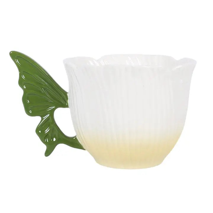 Tekopp med blomsterälvvinge
